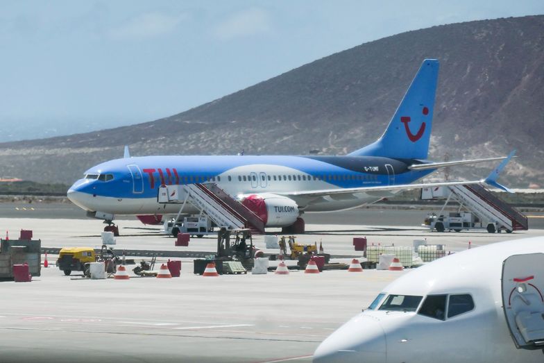 TUI Airways Boeing 737 MAX 8 airplane grounded at Tenerife South - Reina Sofia International Airport TSF GCTS in Tenerife, Canary Islands in Spain, the aircraft has the registration G-TUMF. The plane is grounded with wheels and engines covered since March 12, 2019 as the EASA - European Union Aviation Safety Agency suspended all flight operations of the 737 MAX 8 and 737 MAX 9 with a safety directive because of the MCAS system failure resulting two accidents of the same new aircraft type. The aircraft has the name is Malaga, it arrived from Manchester MAN  to Tenerife Sur TFS with flight number BY2202 but didn't return to Manchester. TUI Airways, formerly Thomson Airways BY TOM TOMJET is the largest charter airline in the world and Tour Operator, the airline already had in service 6 Boeing 737 MAX 8 and 14 Boeing 737 MAX 10 in order. TUI connects Tenerife South Airport to many destinations in United Kingdom, Belgium, Germany and Netherlands as scheduled or summer charter holidays flights. (Photo by Nicolas E