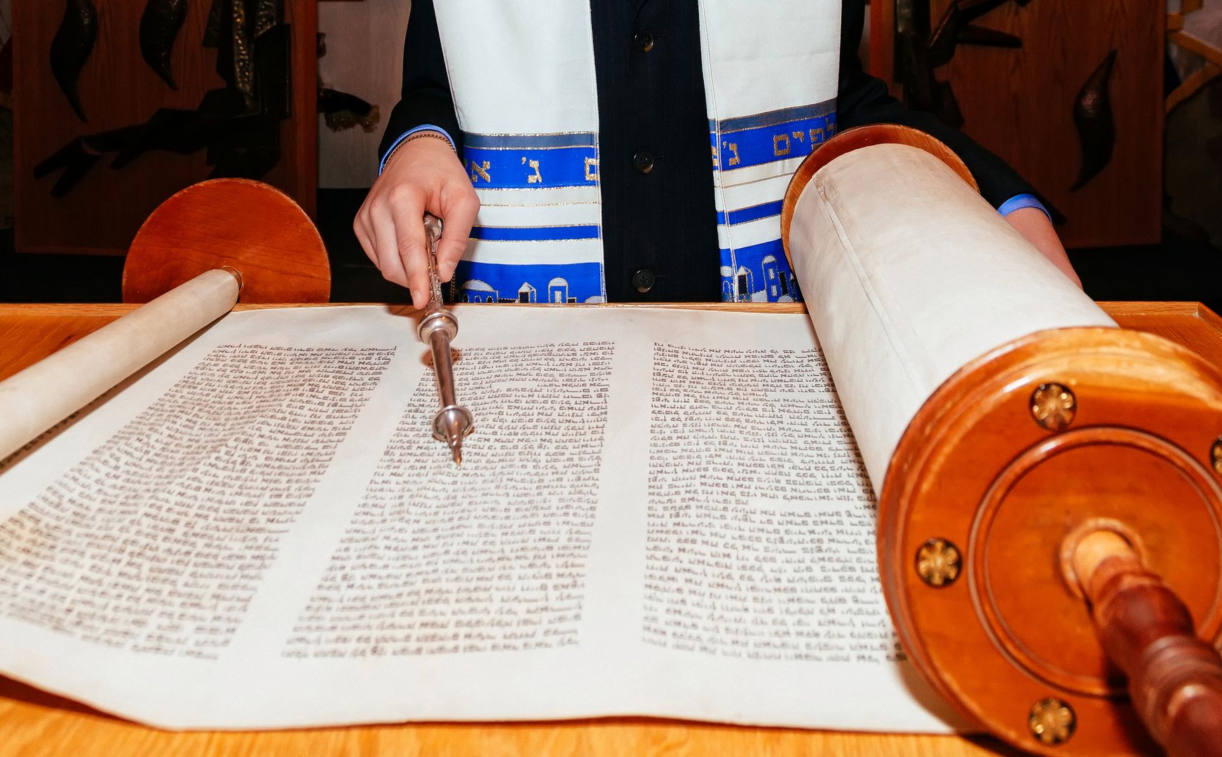 Jewish man dressed in ritual clothing 5 SEPTEMBER 2015 USA NY Hand of boy reading the Jewish Torah at Bar Mitzvah Bar Mitzvah Torah reading