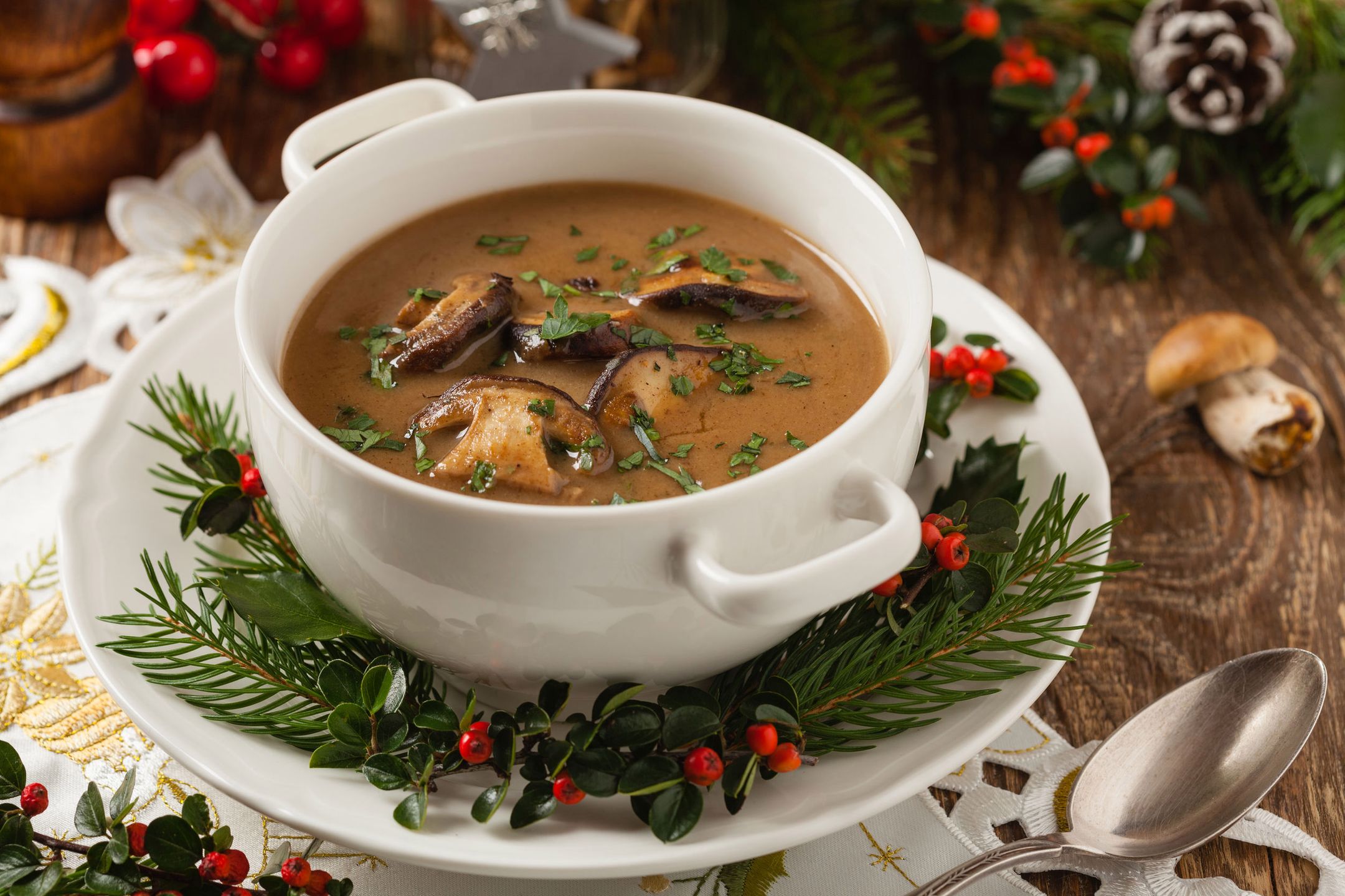 Traditional mushroom soup, made from porcini mushrooms. Christmas decoration. Front view.  
