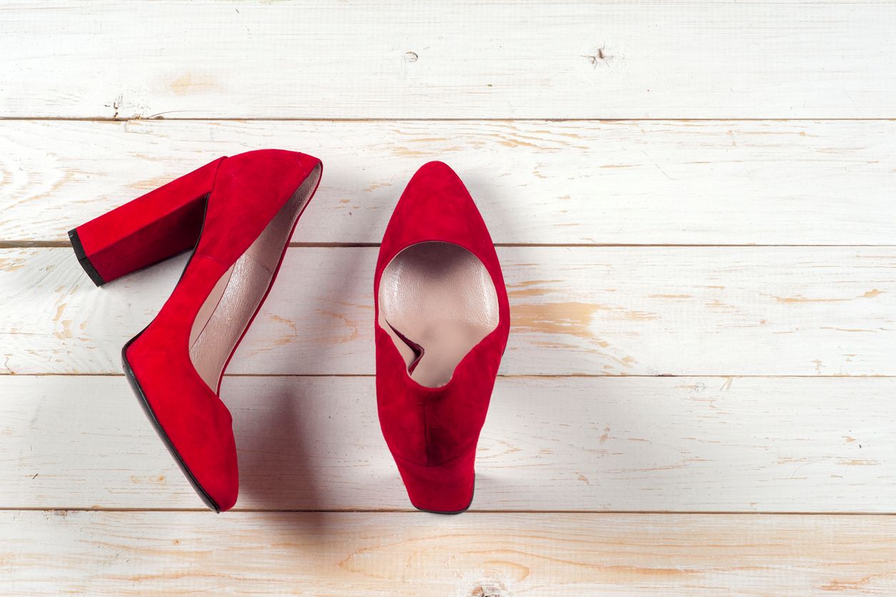Red female shoes on high heels. Minimal fashion concept 