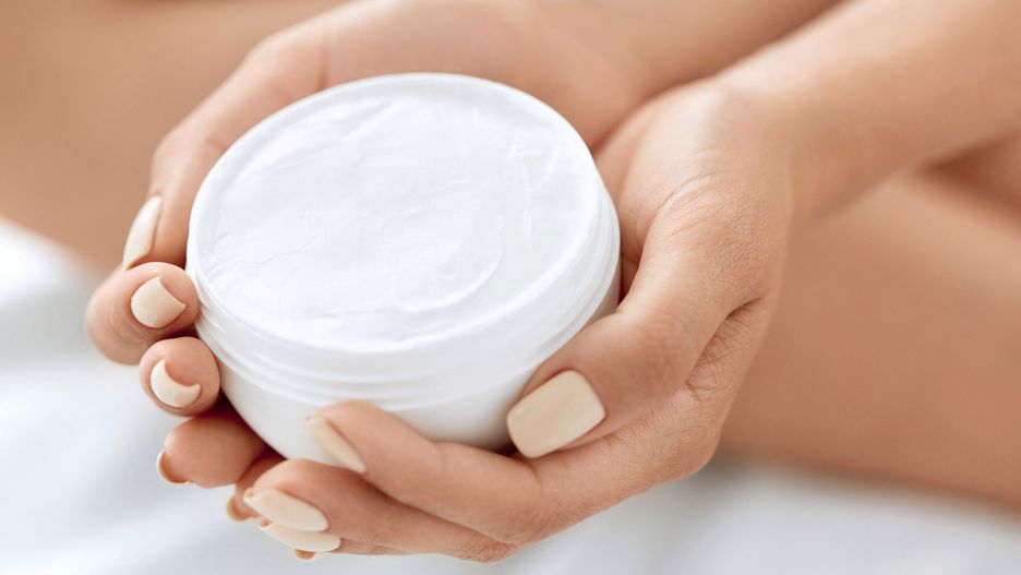Skin Care Product. Closeup Of Woman's Hands Holding Face Cream In A Jar. Beautiful Female Hands With Natural Manicure And Healthy Nails Holding Body Lotion. Beauty Concept