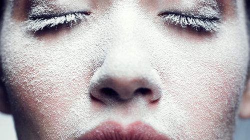 Portrait of beautiful girl with frost on face