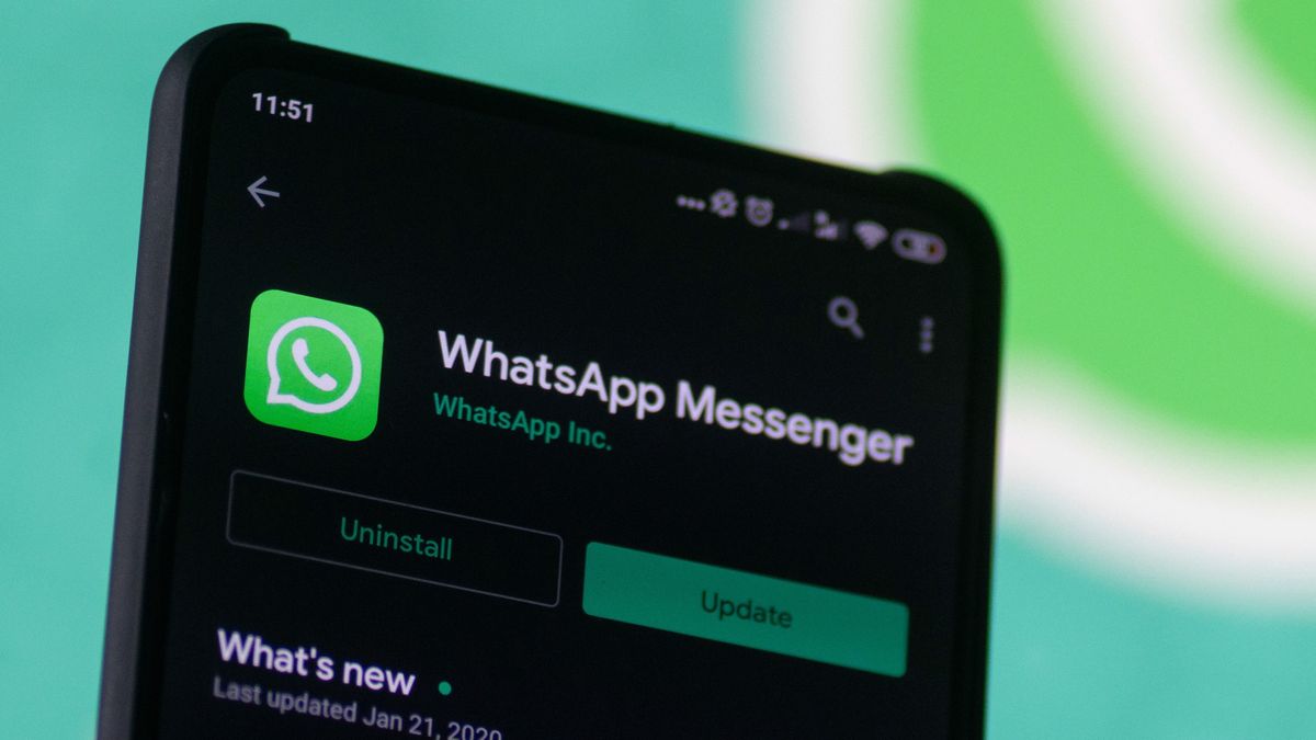 WhatsApp logo displayed on a phone screen, smartphone and keyboard are seen in this multiple exposure illustration. WhatsApp Messenger is a multiplatform mobile application that provides an encrypted instant messaging system belonging to Facebook, photo taken in Amsterdam, Netherlands on January 28, 2020 (Photo illustration by Nicolas Economou/NurPhoto via Getty Images)