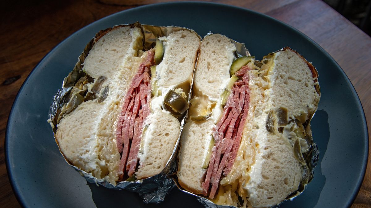 Reuben-style bagel made with a jalapeño and cheddar bagel, salt beef, sauerkraut, gherkin and cream cheeseSimon McGill
