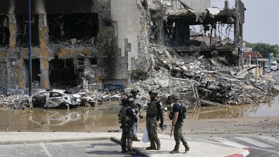 Temporary
Israeli police retrieve weapons used by militants outside a police station that was overrun by Hamas gunmen on Saturday, in Sderot, Israel, Sunday, Oct.8, 2023. Hamas militants stormed over the border fence Saturday, killing hundreds of Israelis in surrounding communities. (AP Photo/Ohad Zwigenberg)
Ohad Zwigenberg