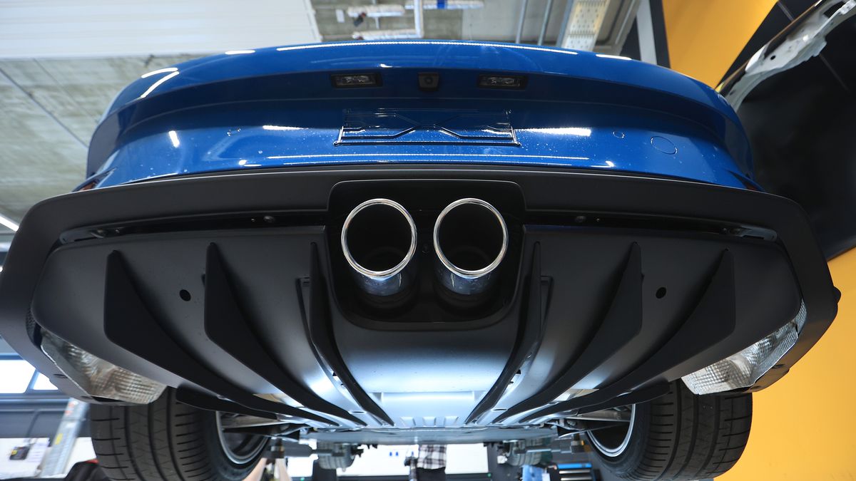 The twin exhaust of a Porsche 911 ST automobile during fitting in the Porsche Exclusive Manufacture unit for special and limited edition vehicles at the Porsche AG Zuffenhausen plant in Stuttgart, Germany, on Thursday, March 6, 2025. Porsche has an increasingly sophisticated vehicle-customization business, comprising the Exclusive Manufaktur program and even more bespoke Sonderwunsch (special request). Photographer: Krisztian Bocsi/Bloomberg via Getty Images