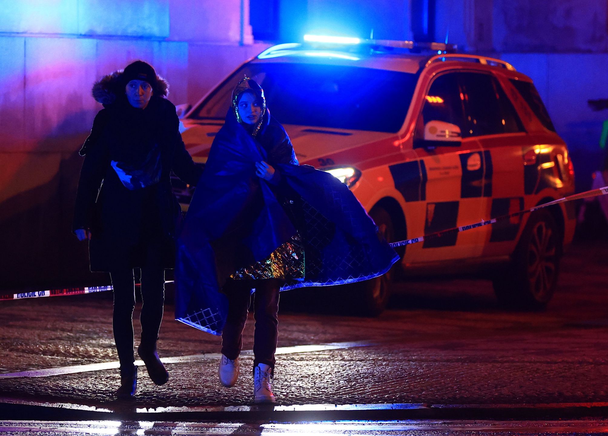 Several dead and dozens injured in central Prague University shooting
epa11040145 A person is escorted from the scene of a shooting at Charles University in central Prague, 21 December 2023. According to the Police President, Martin Vondrasek, there are more than 15 people dead and 24 injured, but that these may not be final numbers. According to Czech police the perpetrator of  was a 24 year-old Charles University student.  EPA/MARTIN DIVISEK  EPA-EFE/MARTIN DIVISEK 
Dostawca: PAP/EPA.
MARTIN DIVISEK