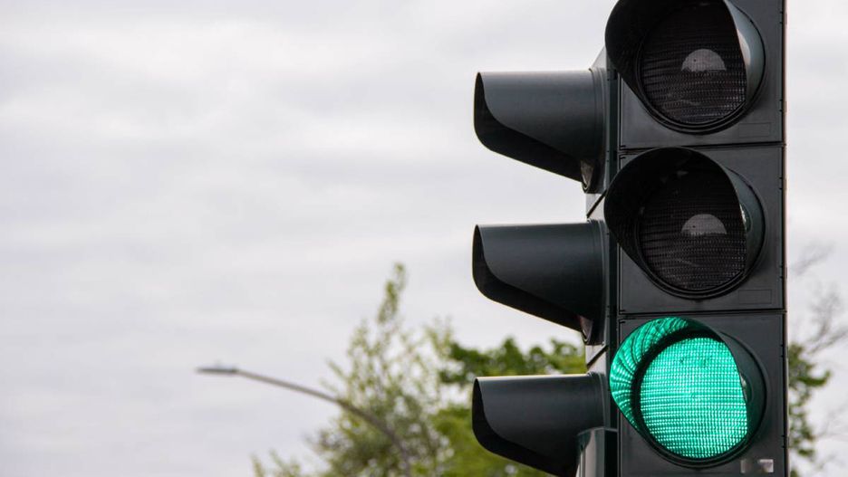 traffic light, green light, black traffic light, signal, transportation, road, urban, street, safety, go, control, traffic signal, bright, illuminated, city, direction, green, transport, driving, intersection, streetlight, traffic control, light, modern, electric, stoplight, crossroad, signal light, road safety, travel, technology, energy, infrastructure, system, street signal, commute, urban scene, movement, signalization, road sign, power, vehicle, transportation system, guidance, regulation, signal device, green signal, urban traffic, led light