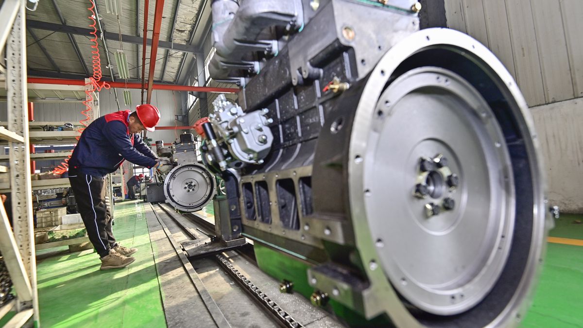 QINGZHOU, CHINA - DECEMBER 27, 2023 - A worker assembles on the production line of an engine manufacturing company in Heguan town, Qingzhou city, East China's Shandong province, Dec 27, 2023. On the same day, the National Bureau of Statistics released data, in November 2023, the national industrial enterprises above designated size to achieve profit growth of 29.5%. From January to November 2023, the total profit of industrial enterprises above designated size in China reached 6,982.28 billion yuan, down 4.4% year-on-year. (Photo credit should read CFOTO/Future Publishing via Getty Images)