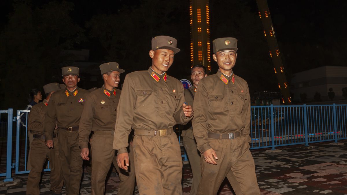 PYONGYANG, NORTH KOREA - SEPTEMBER 13: North Korean soldiers having fun at Kaeson youth park, DGC, Pyongyang, North Korea on September 13, 2012 in Pyongyang, North Korea.