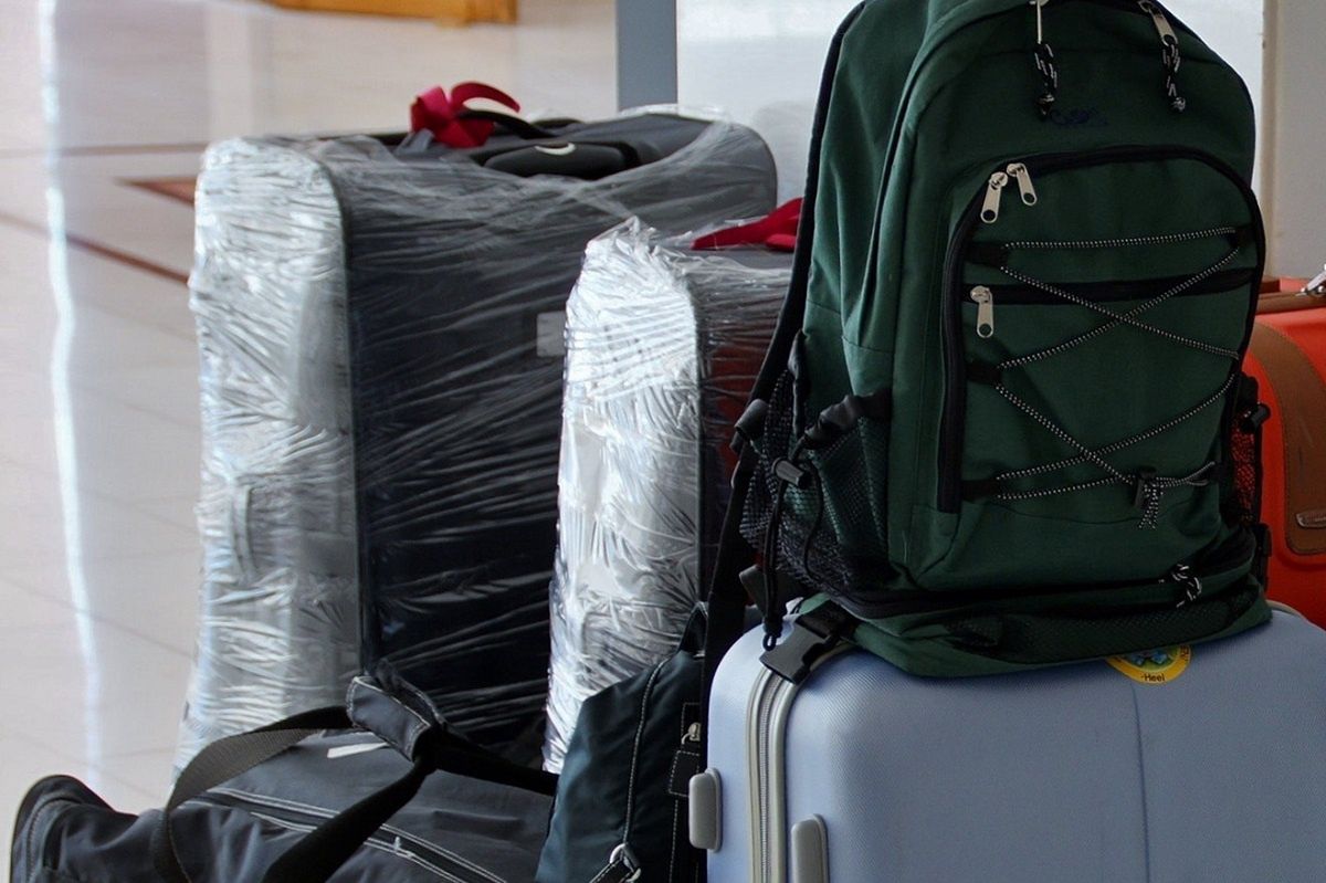 Wrapping a suitcase in foil is becoming more popular. Here's why they do it.