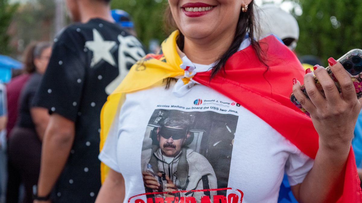 A resident wears a shirt with an image of ousted Venezuelan President Nicolas Maduro in US custody during a celebration at El Arepazo in Doral, Florida, US, on Sunday, Jan. 4, 2026. US President Donald Trump said the US needs "total access" to Venezuela as questions mount about the country's leadership following the capture of President Nicolas Maduro. Photographer: Nicole Combeau/Bloomberg via Getty Images