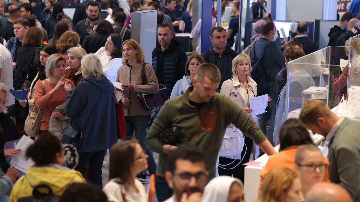BERLIN, GERMANY - OCTOBER 04: People, including many Ukrainians, attend a jobs fair for migrants and refugees on October 04, 2023 in Berlin, Germany. The German government is under increasing pressure to simplify regulations to allow migrants and refugees with at least temporary status to be able to work.  (Photo by Sean Gallup/Getty Images)