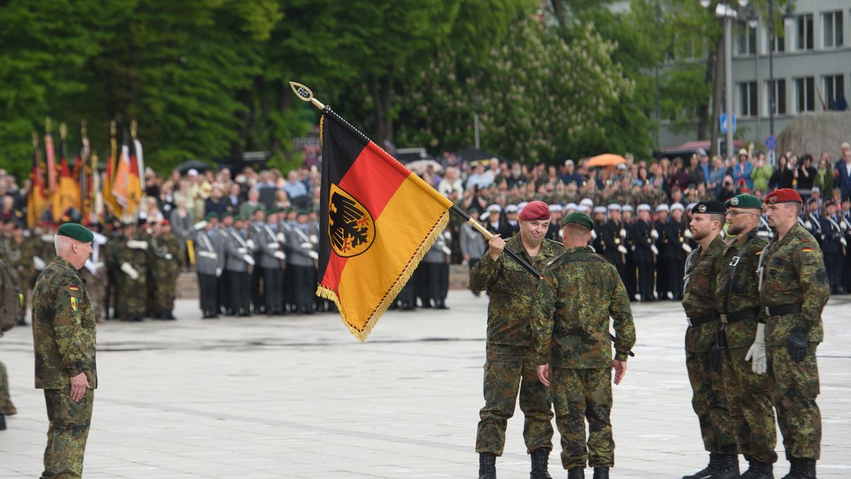VILNIUS, LITHUANIA - 2025/05/22: Members of the German armed forces hand over a Bundeswehr command flag during the inauguration ceremony of the German brigade. The German 45th Armored Brigade "Lithuania" was officially inaugurated at a ceremony held at Cathedral Square in Vilnius, with the participation of German Federal Chancellor Friedrich Merz, German Defence Minister Boris Pistorius, Lithuanian President Gitanas Nausda, and Lithuanian Defence Minister Dovil akalien. Established in Lithuania on 1 April 2025, the brigade is projected to comprise around 5,000 Bundeswehr soldiers and civilian staff, with full combat readiness expected by 2027. (Photo by Yauhen Yerchak/SOPA Images/LightRocket via Getty Images)