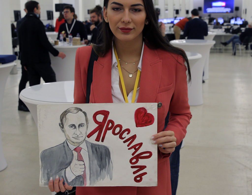 Russian President Putin Holds Annual Press ConferenceMOSCOW, RUSSIA - DECEMBER 23: (RUSSIA OUT) A journalist from Yaroslavl holds a poster featuring Vladimir Putin and name of her town prior to Russian President Vladimir Putin's annual press conference at the Moscow Manege, on December 23, 2021 in Moscow, Russia. More than 500 journalists were invited to Vladimir Putin's end-of-year marathon press conference. (Photo by Mikhail Svetlov/Getty Images)Mikhail Svetlov