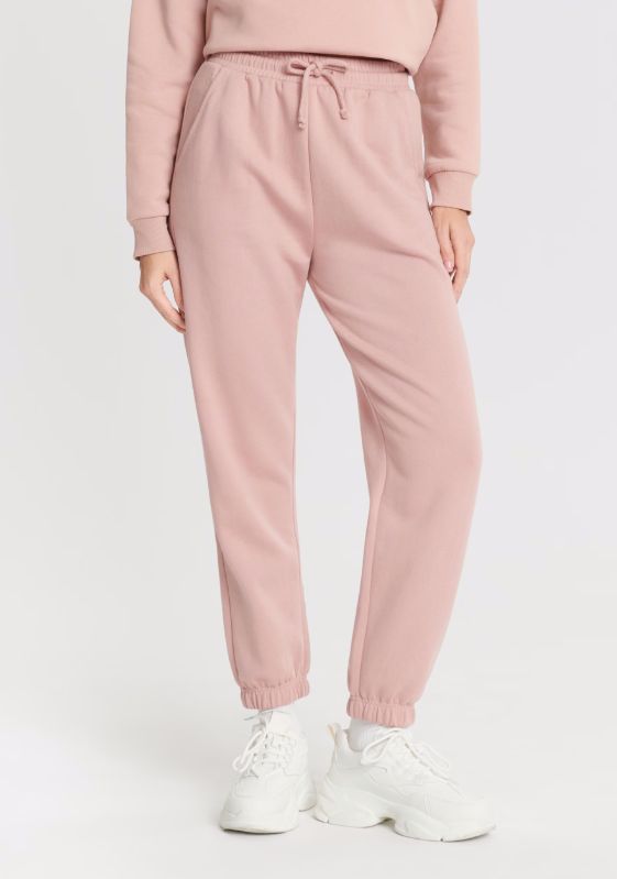 Różowe spodnie dresowe marki Sinsay
