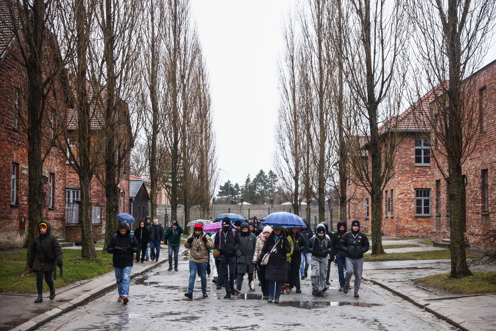 Visitors at the former Nazi German Auschwitz I concentration camp at Memorial and Museum Auschwitz-Birkenau during the 79th Anniversary Of Auschwitz-Birkenau Liberation and Holocaust Remembrance Day in Oswiecim, Poland on January 27, 2024. (Photo by Beata Zawrzel/NurPhoto via Getty Images)