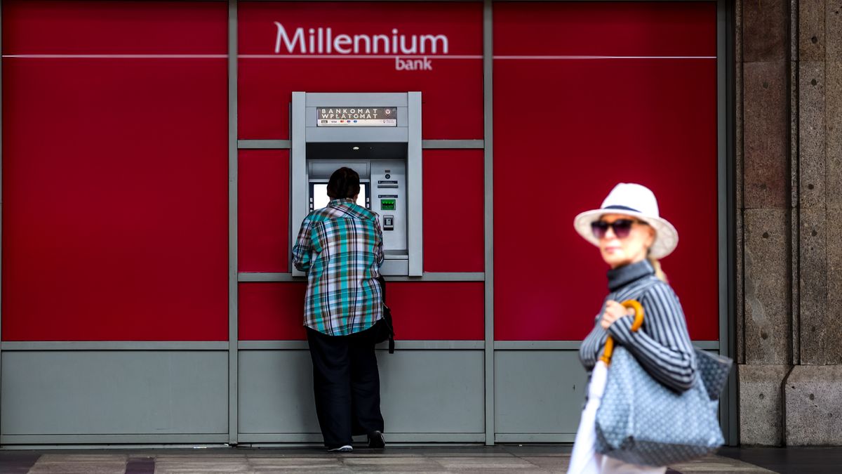 A man stands in front of a Millennium Bank ATM in central Warsaw, the capital of Poland on August 5, 2024. The country's growth has slowed down mainly due to lesser individual consumption than expected as Poland also experiences an effect of EU's excessive deficit procedure against Poland. (Photo by Dominika Zarzycka/NurPhoto via Getty Images)
