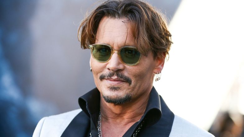 Johnny Depp and Mystery Blonde were spotted together at the London airport