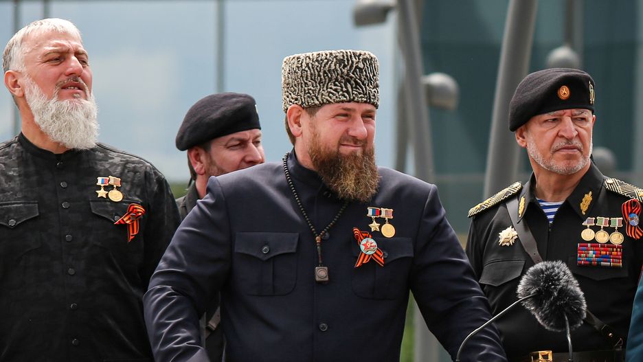 Head of the Chechen Republic Ramzan Kadyrov (С), Interior Minister Ruslan Alkhanov (R) and Russia's State Duma member Adam Delimkhanov attend a military parade on Victory Day, which marks the 77th anniversary of the victory over Nazi Germany in World War Two, in the Chechen capital Grozny, Russia May 9, 2022.