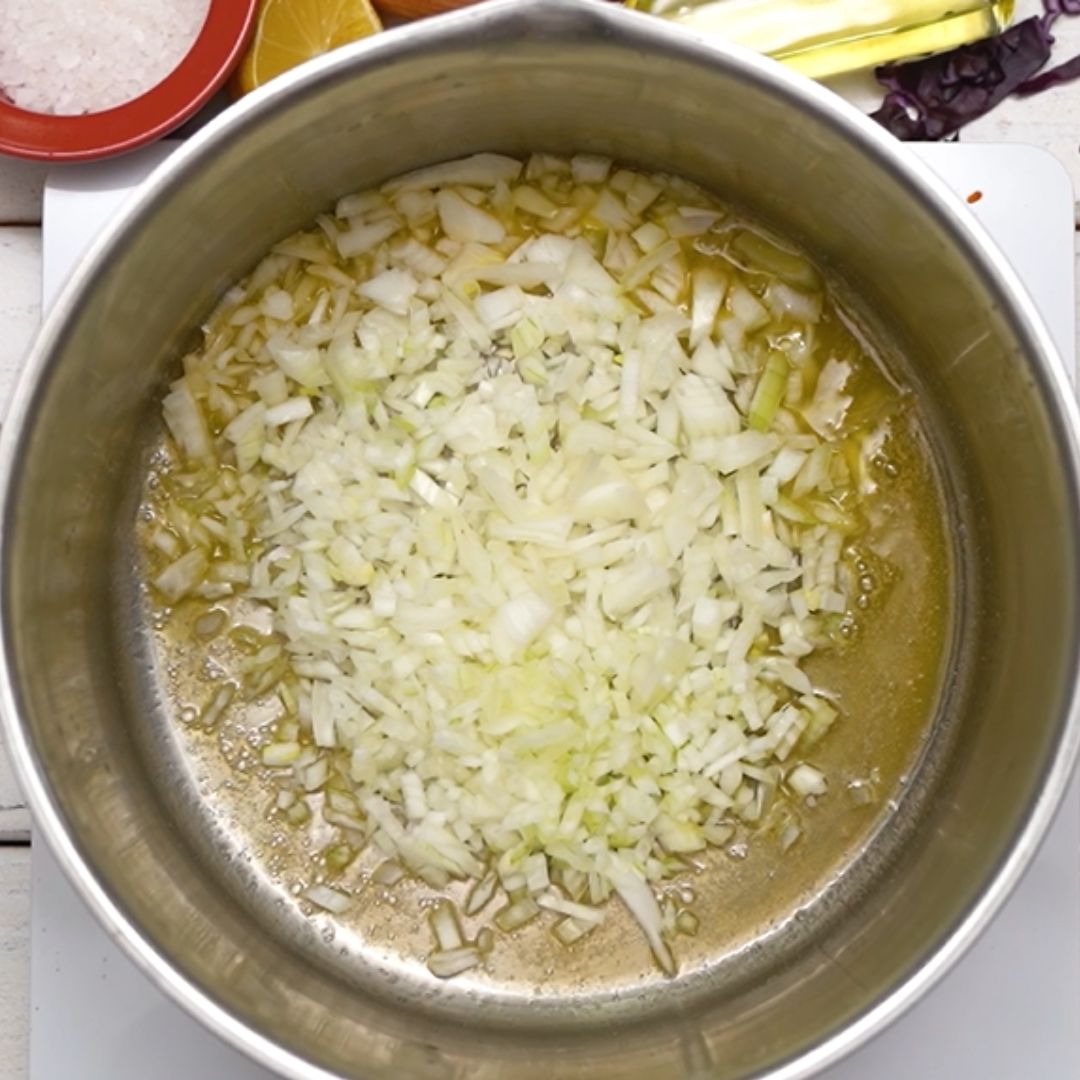 The first ingredient to go into the pot is the onion.
