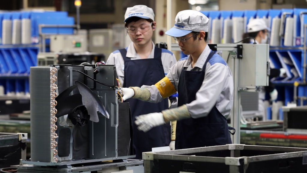 Inside The Daikin Industries' Air Conditioner Plant Ahead Of Japan's 2nd Quarter GDP AnnouncementWorkers assemble an outdoor unit of a Daikin Industries Ltd. split type air conditioner on the production line of the company's Shiga plant in Kusatsu, Shiga, Japan, on Thursday, Aug. 10, 2017. Japan is scheduled to release second-quarter gross domestic product (GDP) data on Aug. 14. Photographer: Buddhika Weerasinghe/Bloomberg via Getty ImagesBloombergEast Asian, Manufacturing, Industry, Industrial, Air Conditioner, Worker, Manufacture, Factory, Laborer, Plant