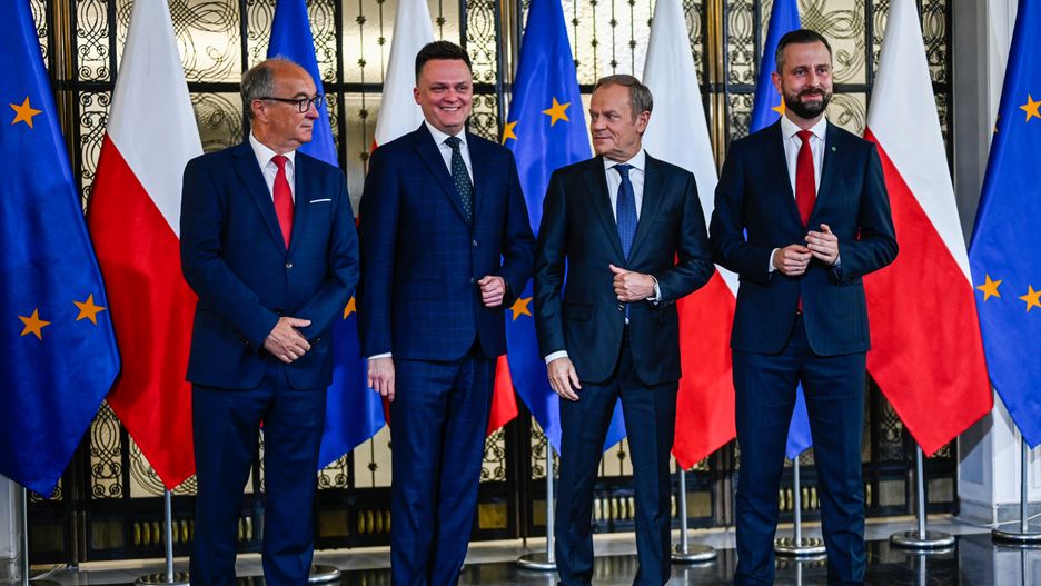 WARSAW, POLAND - OCTOBER 24: One of the leaders of the New Left, Wlodzimierz Czarzasty (L), the leader of Poland 2050 Party, Szymon Holownia (2nd L) , the leader of Civic Coalition (KO), Donald Tusk (2nd R), and the Leader of Polish People's Party (PSL), Wladyslaw Kosiniak Kamysz (R) stand together as they give a press statement in Warsaw, Poland on October 24, 2023. On Tuesday and Wednesday, Oct . 24 and 25 President Andrzej Duda will hold individual consultations with leaders of political parties that have won seats in the parliament of the new term. With the results of the Parliamentary elections out, Poland's democratic opposition made of the Civic Coalition, The Third Way Political alliance, and The New Left has the chance to rule with a majority and all have refused to enter a coalition with the ruling government party, Law and Justice. (Photo by Omar Marques/Anadolu via Getty Images)