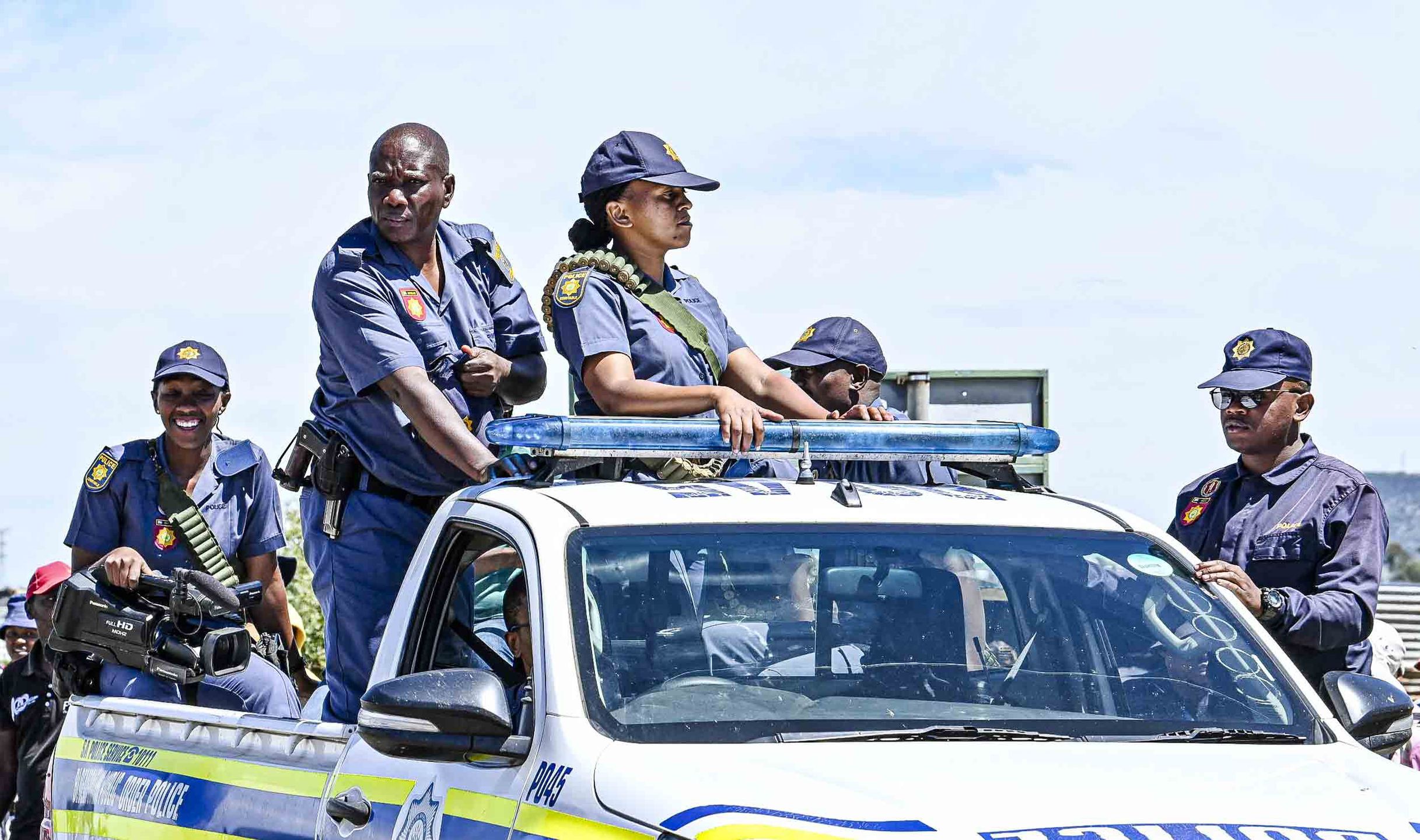 BLOEMFONTEIN, SOUTH AFRICA ? MARCH 05: The police monitor the situation during a Lourierpark residents protest against illegal land occupiers on March 05, 2024 in Bloemfontein, South Africa. This comes after about 1500 illegal land occupiers flocked to the area. The Democratic Alliance (DA) has approached the High Court In Bloemfontein for an urgent  court order to remove the occupiers. (Photo by Mlungisi Louw/Volksblad/Gallo Images via Getty Images)