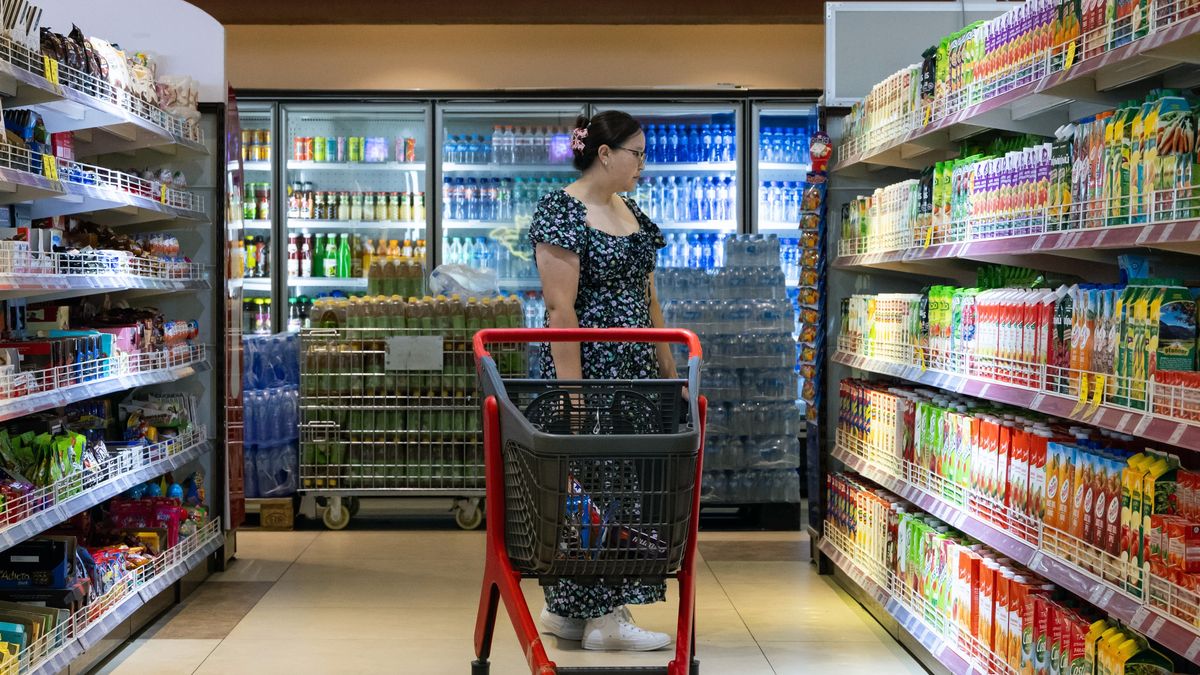 A customer looks at beverages at a supermarket in Ulaanbaatar, Mongolia, on Wednesday, Aug. 30, 2023. Mongolia's real GDP grew 6.4% y/y to 13.6 trillion tugrik ($3.94 billion) in the first half of 2023, according to preliminary results in a report from the National Statistics Office. Photographer: SeongJoon Cho/Bloomberg via Getty Images