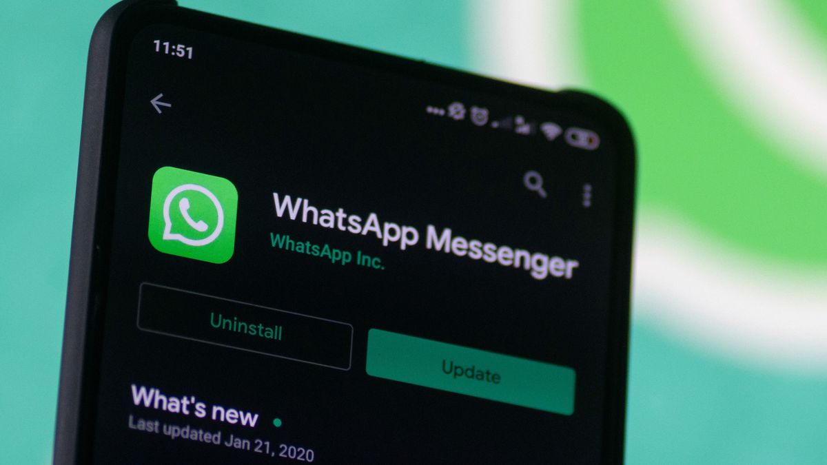 WhatsApp logo displayed on a phone screen, smartphone and keyboard are seen in this multiple exposure illustration. WhatsApp Messenger is a multiplatform mobile application that provides an encrypted instant messaging system belonging to Facebook, photo taken in Amsterdam, Netherlands on January 28, 2020 (Photo illustration by Nicolas Economou/NurPhoto via Getty Images)