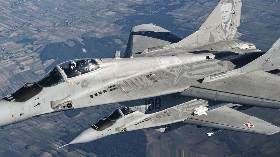 LASK, POLAND - OCTOBER 12 : A Raftor F22 from US Air Force, F 16 fighter jets and MIG 29 of the Polish Air Force take part in a NATO Air Force military drill on October 12, 2022 in Lask, Poland. (Photo by Stringer/Anadolu Agency via Getty Images)