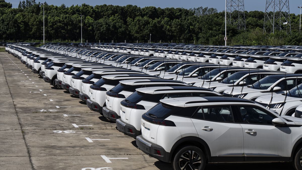 Vehicles manufactured by Dongfeng Peugeot-Citroen Automobile Ltd., a joint venture between Dongfeng Motor Group Co. and PSA Peugeot Citroen, at a lot in Wuhan, China, on Monday, July 22, 2024. Dongfeng Motor, which in addition to making Stellantis branded Peugeot and Citroen cars in China also partners with Honda and Nissan, is under pressure at home where demand for gasoline cars has been falling. Photographer: Qilai Shen/Bloomberg via Getty Images