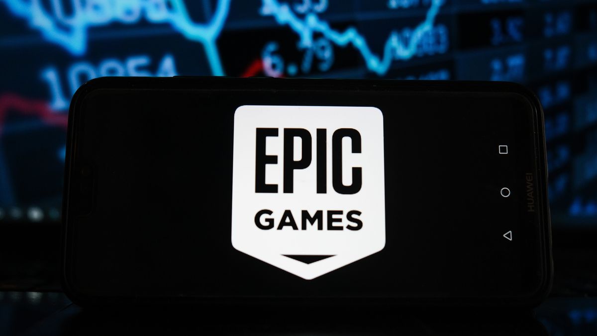 POLAND - 2021/03/21: In this photo illustration an Epic Games logo seen displayed on a smartphone with stock market percentages in the background. (Photo Illustration by Omar Marques/SOPA Images/LightRocket via Getty Images)