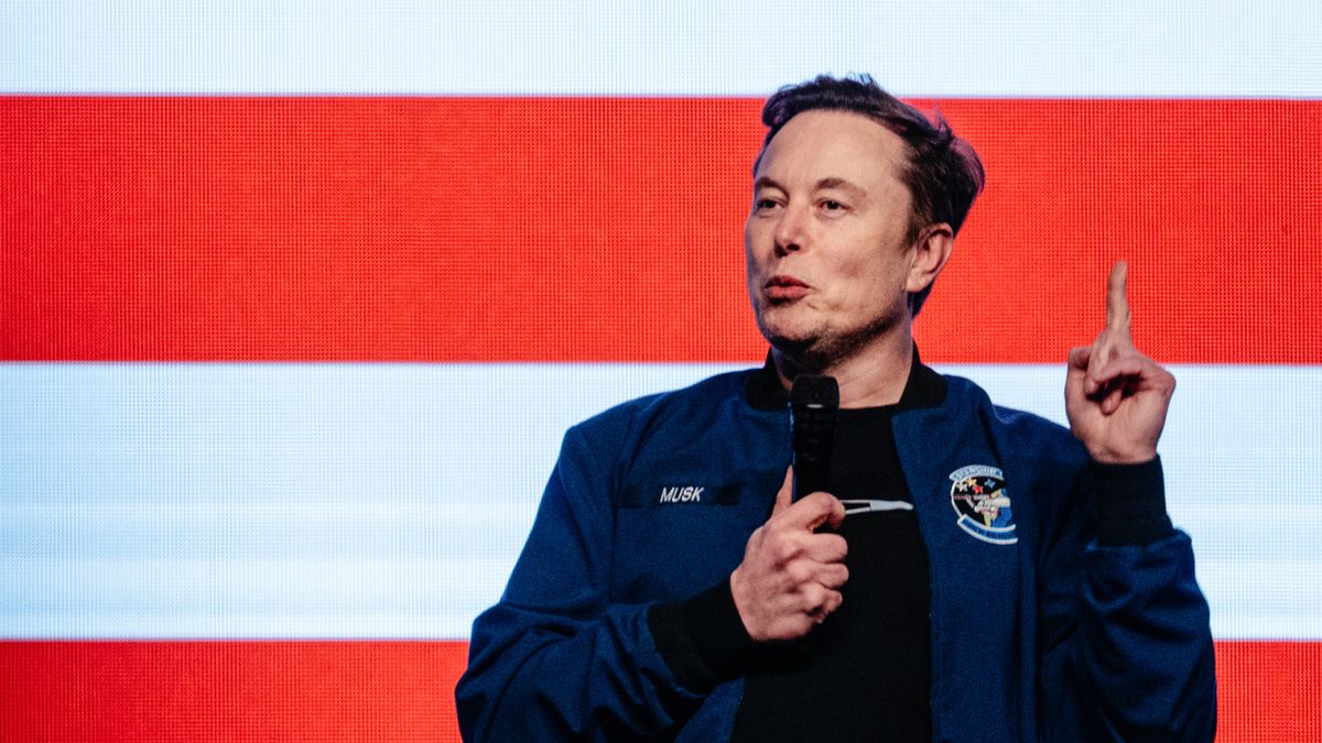 Elon Musk, chief executive officer of Tesla Inc., speaks during an America PAC town hall ahead of the Wisconsin Supreme Court election at the KI Convention Center in Green Bay, Wisconsin, US, on Sunday, March 30, 2025. Musk's plan to hand out $1 million checks to two residents for participating in Wisconsin's Supreme Court election is barred by state law, a new complaint said Friday. Photographer: Jamie Kelter Davis/Bloomberg via Getty Images