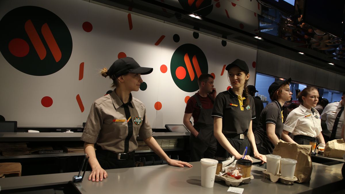 MOSCOW, RUSSIA - JUNE,12 (RUSSIA OUT) Employees seen at a newly opened fast food restaurant in a former McDonald's outlet at Pushkinskaya Square, June,12,2022, in Moscow, Russia. The first of former McDonald's restaurants is reopened with new brand called "Vkusno i tochka" ("Tasty and point") in Moscow as the corporation sold its branches in Russia to a local businessman after Putin sent troops into Ukraine. (Photo by Contributor/Getty Images)