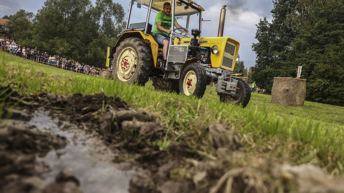 A participant attends a tractors race called 'Traktoryja' organized as part of traditional Dozhinki harvest festival. Gieraltowice, Wadowice County in Poland on August 28, 2022. Participants raced in five different classes according to engine power of a tractor. For the first time women took part in the race. (Photo by Beata Zawrzel/NurPhoto via Getty Images)