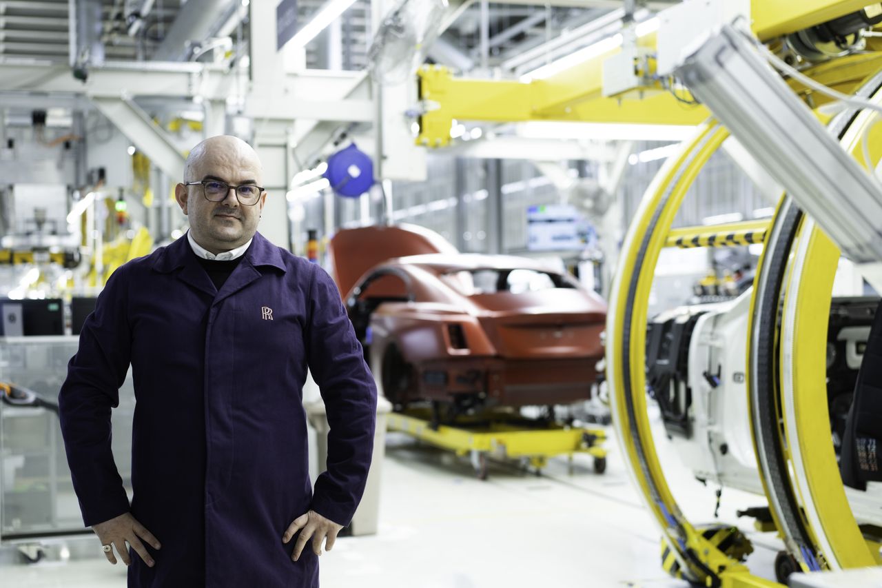 On that particular day, the assembly line was dominated by white and black cars. The red Spectre stood out against them.