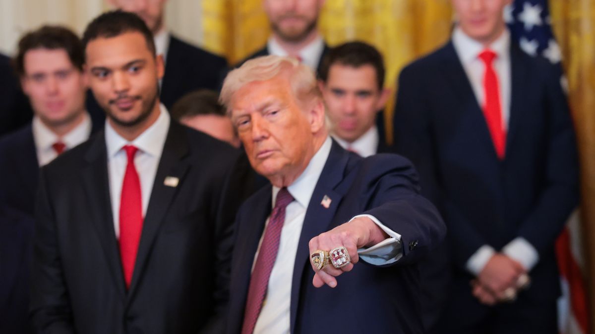 WASHINGTON, DC - JANUARY 15: U.S. President Donald Trump holds up his fist to show two Stanley Cup rings presented to him by the 2025 Stanley Cup Champion Florida Panthers in the East Room of the White House on January 15, 2026 in Washington, DC. The Florida Panthers defeated the Edmonton Oilers for the second straight year in their first-ever championships since joining the NHL in 1993. (Photo by Anna Moneymaker/Getty Images)