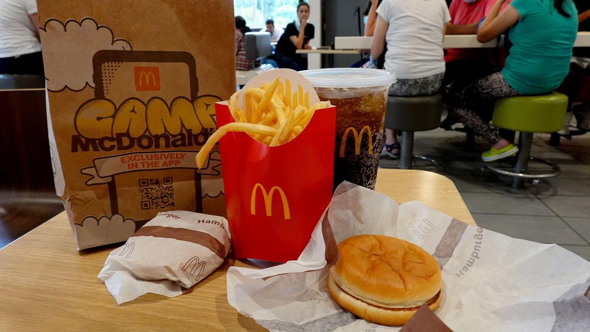 MIAMI, FLORIDA - JULY 26:   In this photo illustration, McDonald's food sits on a table in one of the fast food restaurants on July 26, 2022 in Miami, Florida. The McDonald's company reported U.S. same-store sales rose 3.7%, while international sales rose 9.7% during the most recent quarter. However, it also said that total revenue fell 3% to $5.72 billion; it attributed the weakness to slowing demand in China. (Photo illustration by Joe Raedle/Getty Images)