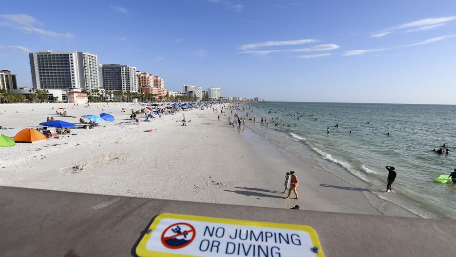 A ''No Jumping or Diving'' warning sign is on the platform of Pier 60 in Clearwater Beach, Florida, USA. (Photo by Ronaldo Silva/NurPhoto via Getty Images)