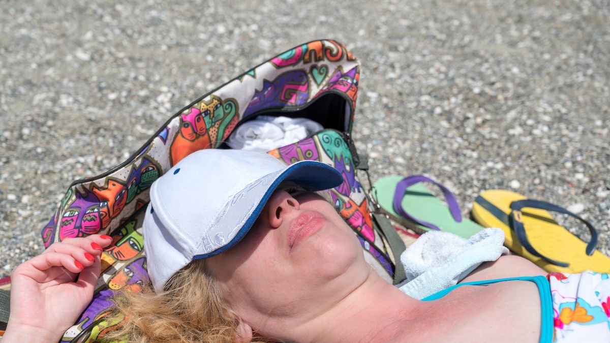 50 year old woman sunbathing on a beach in Larnaca Bay, Cyprus
A blonde woman in her 50s, with a baseball cap, relaxes and sunbathes on a quiet beach in Larnaca Bay, Cyprus, on a sunny day.
PaoloBis