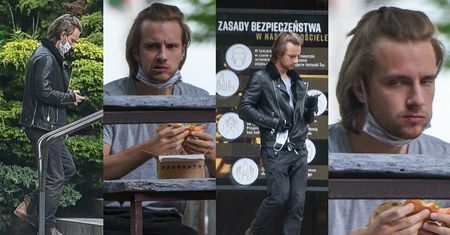 Osobliwie uczesany Maciej Musiał zajada burgera, po czym pędzi na mszę do pobliskiego kościoła. Dobrze się prezentuje? (ZDJĘCIA)
