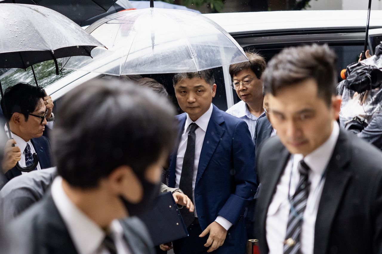 Billionaire Brian Kim released on bail amid stock probe