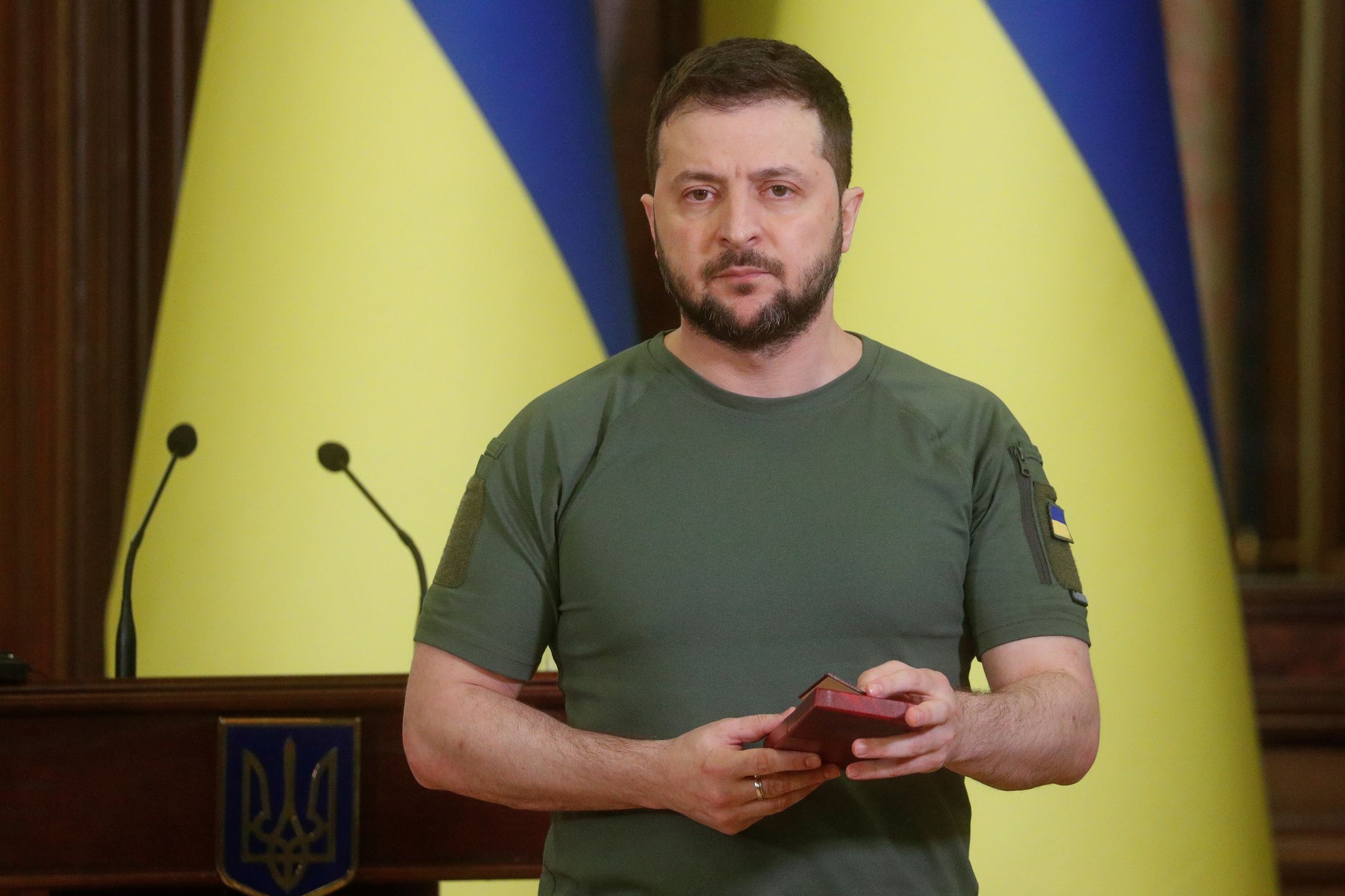 Ukraine's President Volodymyr Zelenskiy awards employees of the Chornobyl Nuclear Power Plant who were under Russian captivity at the plant, during a joint news conference with International Atomic Energy Agency (IAEA) Director General Rafael Grossi (not pictured), as Russia's attack on Ukraine continues, in Kyiv, Ukraine April 26, 2022.
