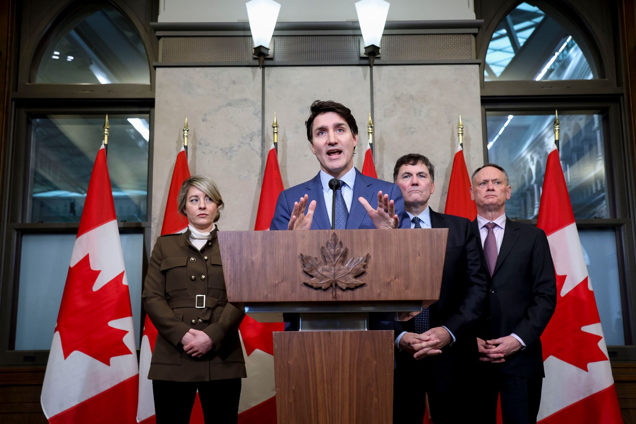 Melanie Joly, Canada's foreign minister, from left, Justin Trudeau, Canada's prime minister, Dominic LeBlanc, Canada's finance and intergovernmental affairs minister, and David McGuinty, Canada's minister of public safety, during a news conference in Ottawa, Ontario, Canada, on Tuesday, March 4, 2025. US President Donald Trump delivered on his threat to hit Canada with sweeping import levies spurring swift reprisals that plunged the world economy into a deepening trade war. Photographer: David Kawai/Bloomberg via Getty Images