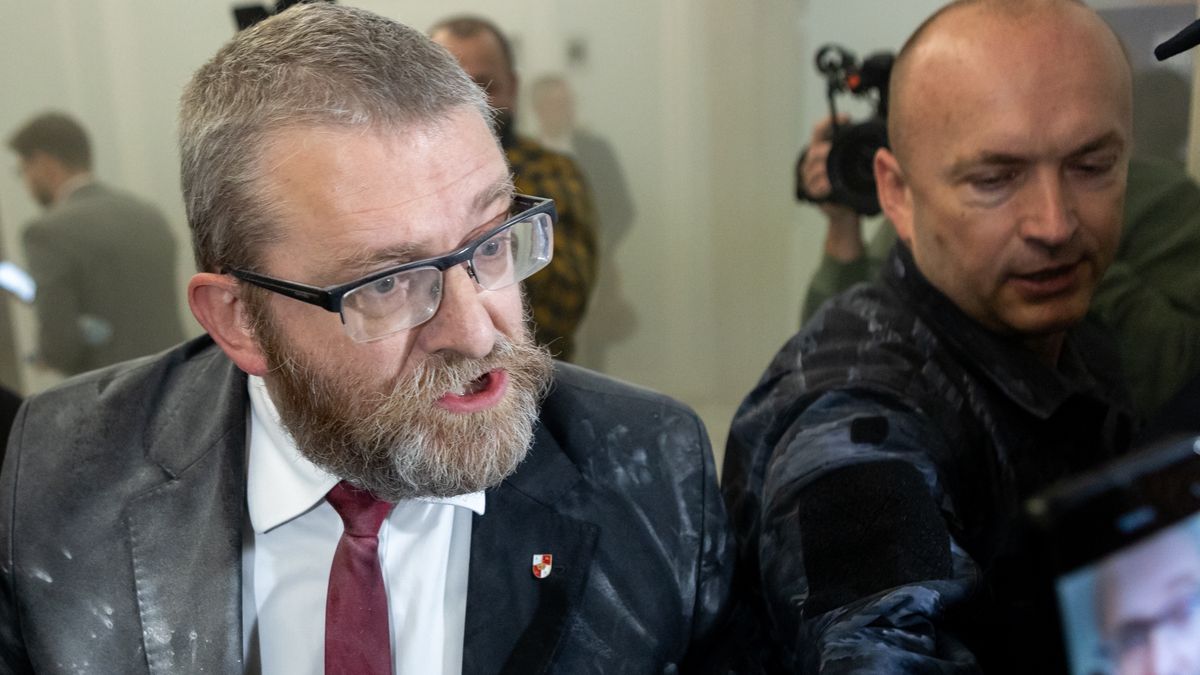 Grzegorz Braun, a far-right Polish lawmaker, is using a fire extinguisher on Hanukkah candles in parliament in Warsaw, Poland, on December 12, 2023. (Photo by Foto Olimpik/NurPhoto via Getty Images)