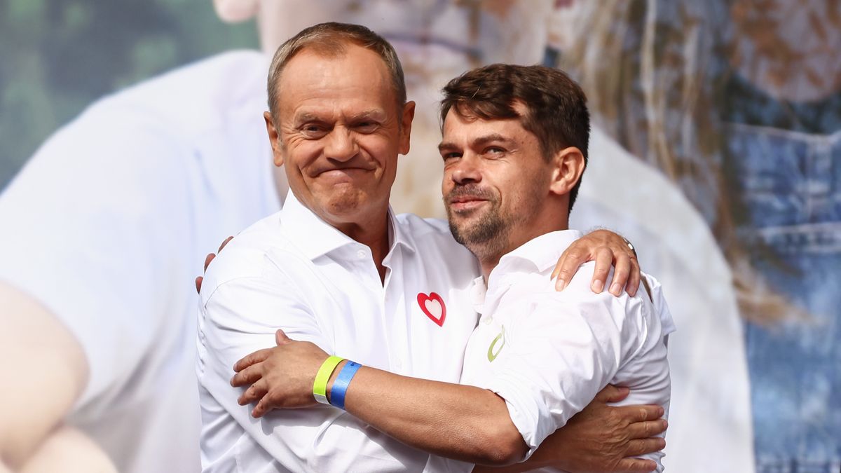 PDonald Tusk, the leader of the Civic Platform party (PO) and Michal Kolodziejczak, the leader of Agrounia union organization of farmers, hug during  'Million Hearts March' organized by Civic Coalition (KO) in Warsaw, Poland on October 1st, 2023. The largest demonstration in recent years in Poland gathered people to protest against Poland's conservative government two weeks ahead of a general election. (Photo by Beata Zawrzel/NurPhoto via Getty Images)