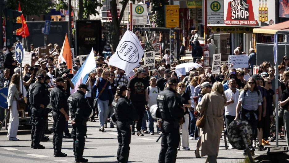 HAMBURG, GERMANY - MAY 11: People gather to protest in favor of banning the far-right Alternative for Germany (AfD) political party on May 11, 2025 in Hamburg, Germany. Similar protests are taking place nationwide today following an announcement recently by the Office for the Protection of the Constitution (Bundesamt fuer Verfassungsschutz), Germany's domestic intelligence agency, classifying the party as right-wing extremist. The AfD is countering the assessment with a court filing. (Photo by Morris MacMatzen/Getty Images)
