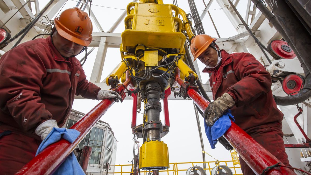 AKSU, CHINA - NOVEMBER 12: Employees operate an oil drilling rig at the Yuejin 3-3 well operated by China Petrochemical Corporation (Sinopec Group) in the Tarim Basin on November 12, 2023 in Aksu Prefecture, Xinjiang Uygur Autonomous Region of China. China started to test the 9,432-meter-deep Yuejin 3-3 well, the deepest oil and gas well in Asia on November 15. (Photo by VCG/VCG via Getty Images)