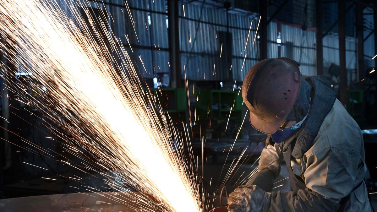 JINHUA, CHINA - FEBRUARY 26: A worker polishes steel at the polishing workshop of Zhejiang Wujing Machine Manufacture Co., Ltd. on February 26, 2024 in Jinhua, Zhejiang Province of China. (Photo by VCG/VCG via Getty Images)